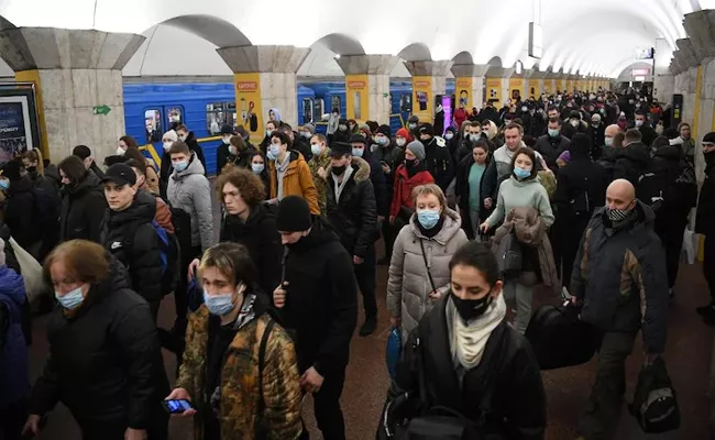 Ukrainian Takes Shelter in Underground Metro Station Amid Russian Invasion - Sakshi