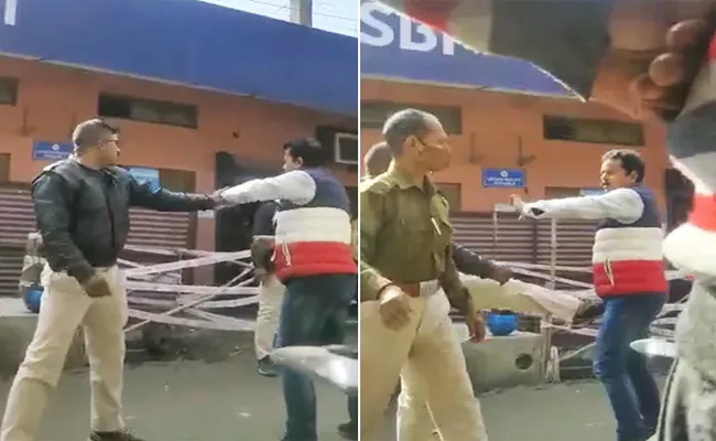 Assam Journalist Jayant Debnath Being Beaten By The Two Cops  - Sakshi