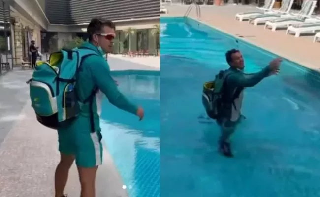 Alex Carey hilariously falls into swimming pool while speaking to teammates - Sakshi