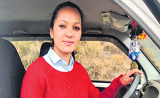 Meenakshi Negi drives a tourist cab in Shimla - Sakshi