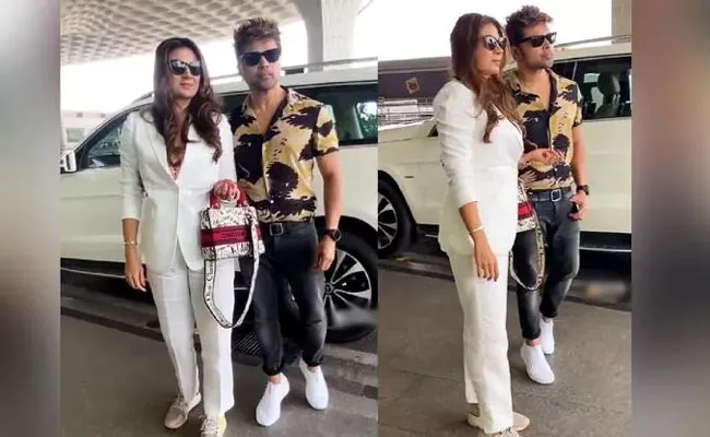 Himesh Reshammiya Stands on His Toes to Pose with His Wife Sonia Kapoor - Sakshi