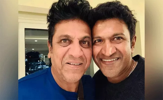 Shiva Rajkumar Watches Puneeth Rajkumar Last Film James In Mysuru - Sakshi