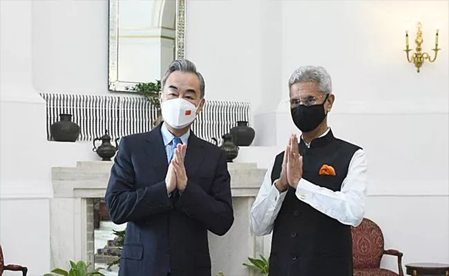 China Foreign Minister Wang Yi meets S Jaishankar in Delhi - Sakshi