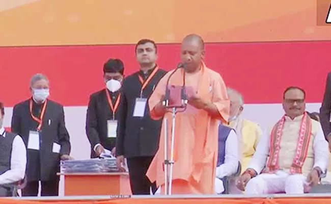 Yogi Adityanath Takes Oath As Uttar Pradesh CM For Second Time - Sakshi