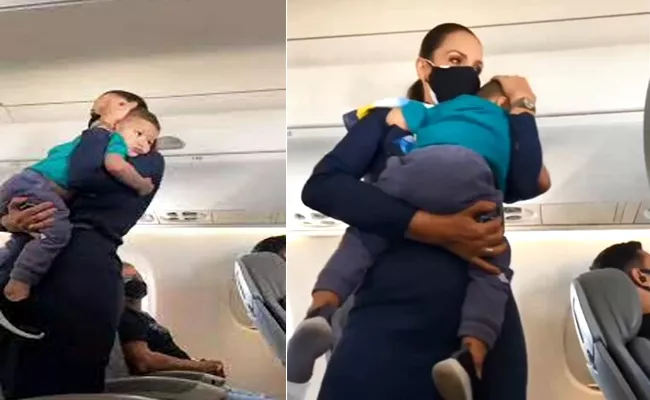 Viral Video: Flight Attendant Consoling Crying Kid Wins Internet Emotional - Sakshi