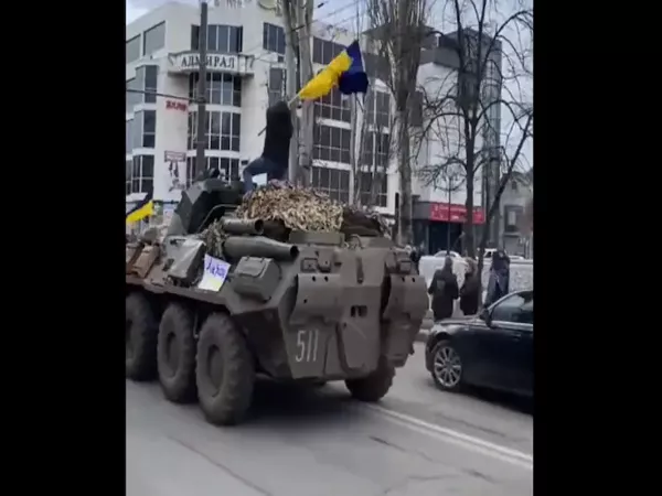 Ukrainian Man Climbing Onto Russian Tank Waves National Flag - Sakshi