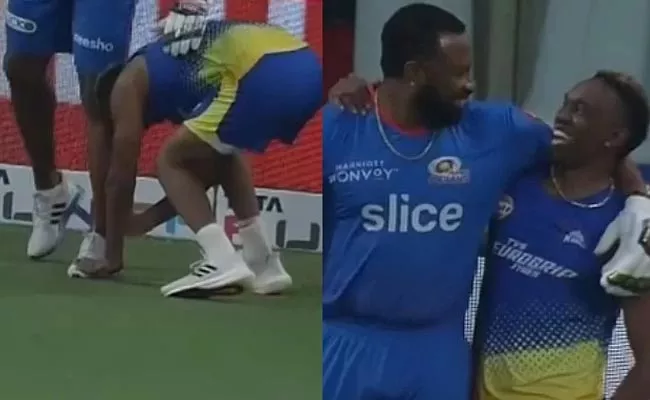 Dwayne Bravo touches Kieron Pollards feet In IPL 2022 - Sakshi