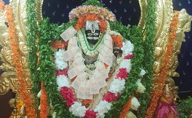 Decoration Wth Currency Notes For Lakshmi Narasimha Swamy - Sakshi