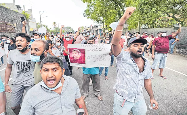 Protesters in Sri Lanka defy curfew, police fire tear gas at students - Sakshi