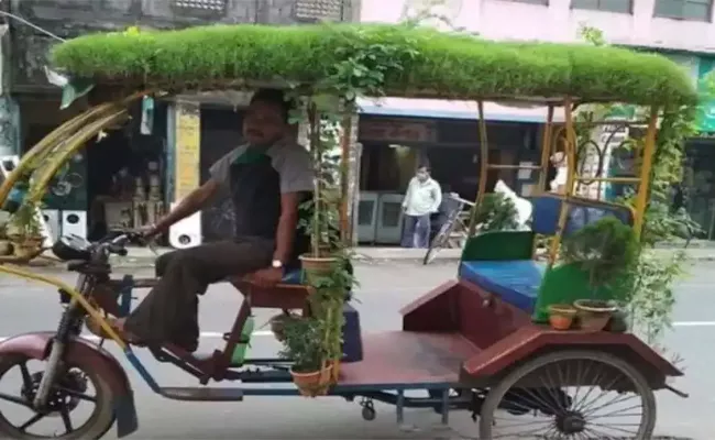 Man His Rickshaw Covered With Lush Layer Of Grass Viral - Sakshi