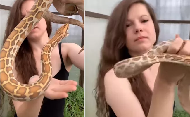 Viral Video: Girl Holding The Snake In Her Hands While Trying To Control - Sakshi