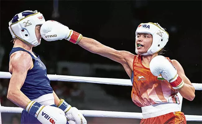 Boxing World Championships: Nikhat Zareen Secures Indias First Medal - Sakshi