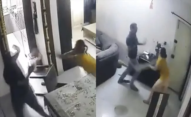 Viral Video: Woman Beats Up Husband With Cricket Bat In Front of Son - Sakshi