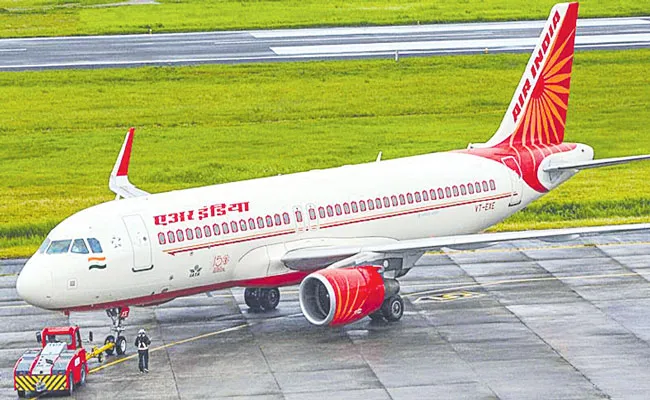 CCI Approves Proposed Acquisition Of AirAsia India By Air India - Sakshi