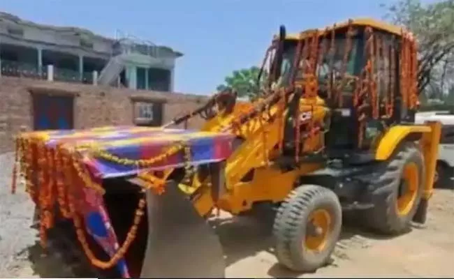 Groom Rides Bulldozer To Brides House Goes Viral - Sakshi