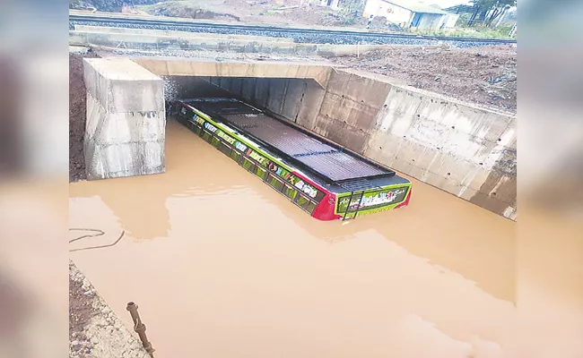 Marriage Bus ubmerged in Rain Water Near Vikarabad - Sakshi