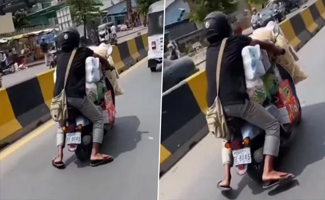 Viral Video: Man Rides Overloaded Scooter, Telangana Police Share Advice - Sakshi