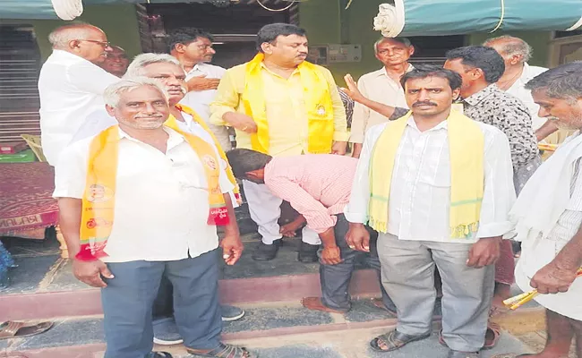 TDP MLC Wearing Shoes With Pary Activist in Vijayawada - Sakshi