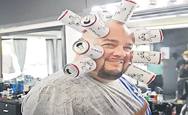 Magnet Head US Man Sticks 10 Cans Creates Guinness World Record - Sakshi