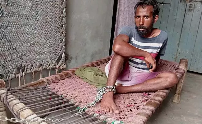 A Man Seen Chained To A Cot In His Parents - Sakshi