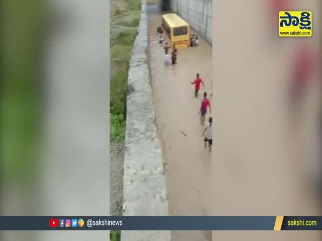 Private School Bus Stuck In Rain Water In Mahabubnagar