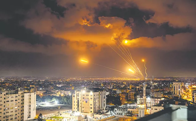 Israel pounds Gaza with air strikes - Sakshi