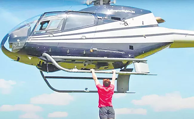 Fitness Influencer Breaks Guinness World Record By Doing Pull Ups From Helicopter - Sakshi