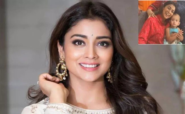 Heroine Shriya Saran Reveals Her Daughter Radha Face In Recent Photo - Sakshi