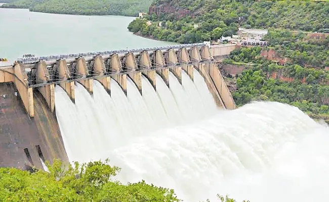 Rising flood in Krishna River Andhra Pradesh - Sakshi