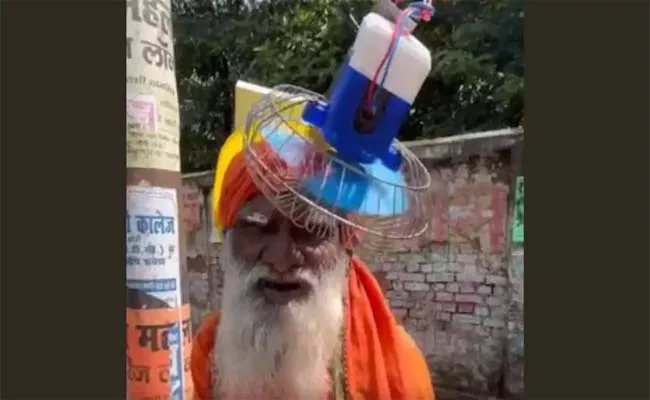 Man Wearing Helmet With Fan And Solar Panel Attached To It Goes Viral - Sakshi