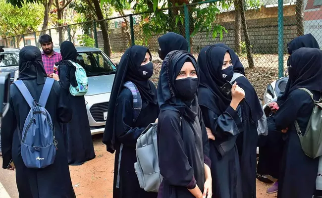 Karnataka Government Defends Hijab Ban In Educational Institutions - Sakshi