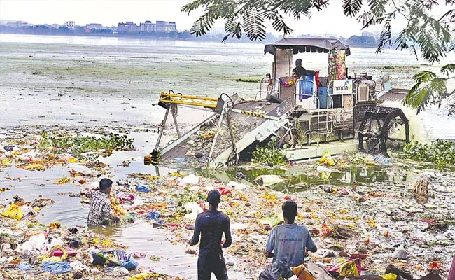 Huge Pollution Increase in Hussainsagar After Ganesh Immersion - Sakshi