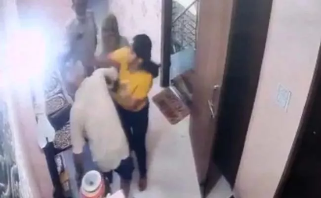 Viral Video: Woman Cop Slapping Her Father In Law Multiple Times  - Sakshi