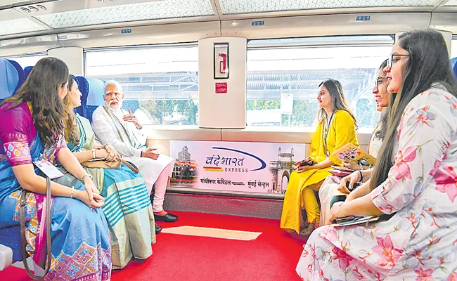 PM Narendra Modi flags of Gandhinagar to Mumbai Central Vande Bharat Express train - Sakshi