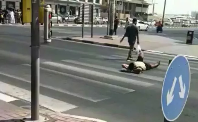 Dubai Police Arrest Man Lies Down With Pillow On Road Viral Video - Sakshi