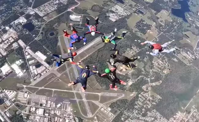 8 People Age 80 Set Guinness World Record By Jumping Out Plane - Sakshi