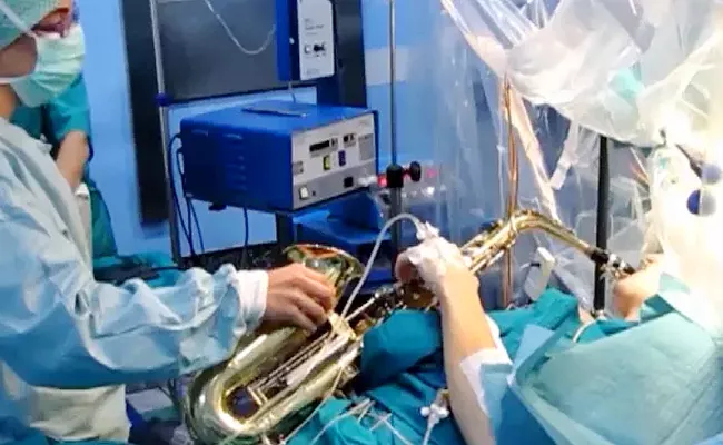 Musician  Undergoing Brain Surgery In Italy While Playing Saxophone - Sakshi