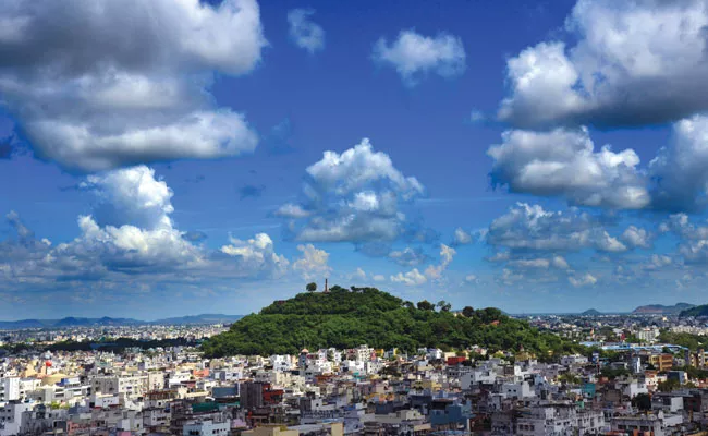 Vijayawada in The Shade of Blue Sky and White Clouds, Krishna River, Durga Ghat - Sakshi