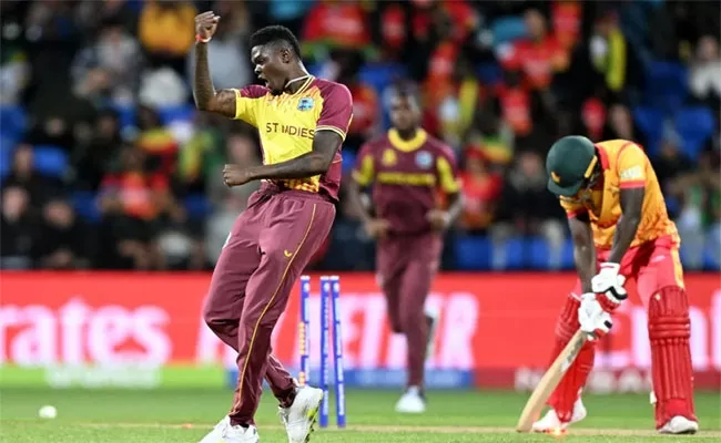 T20 WC: Alzarri Joseph Takes Four As West Indies Beat Zimbabwe By 31 Runs - Sakshi