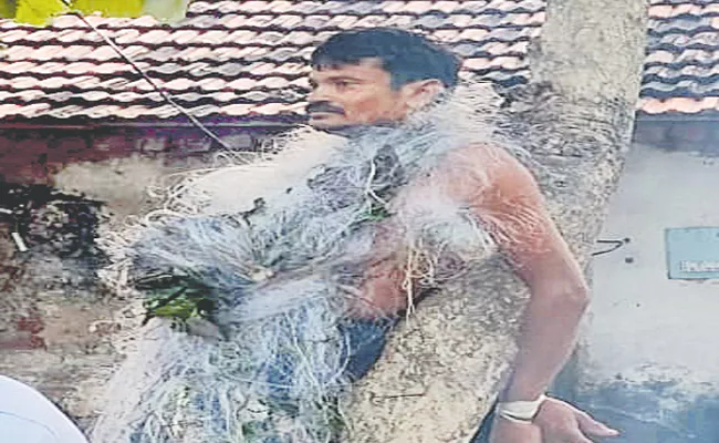 Man Beaten up after being tied to tree For Catching Fish On Pond In Warangal - Sakshi