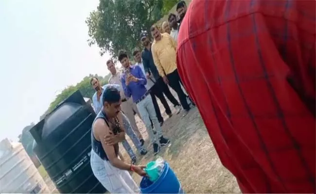 Viral Video: Delhi Jal Board Officer Takes Bath In Yamuna Water  - Sakshi