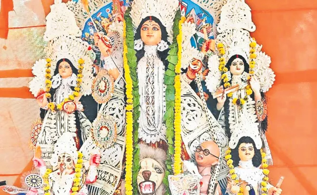 Controversy Over Durga Pandal With Gandhi Like Face - Sakshi