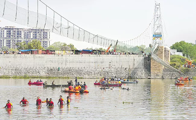 Morbi bridge collapse: Morbi suspension bridge collapse kills 134 in Gujarat - Sakshi