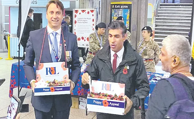 British PM Rishi Sunak Surprises Commuters By Selling Poppies - Sakshi