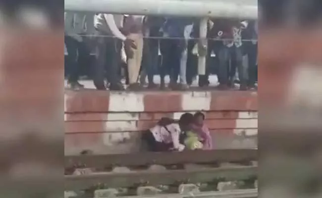 Woman And Son Narrow Escape Sit Platform Wall Train Passed - Sakshi