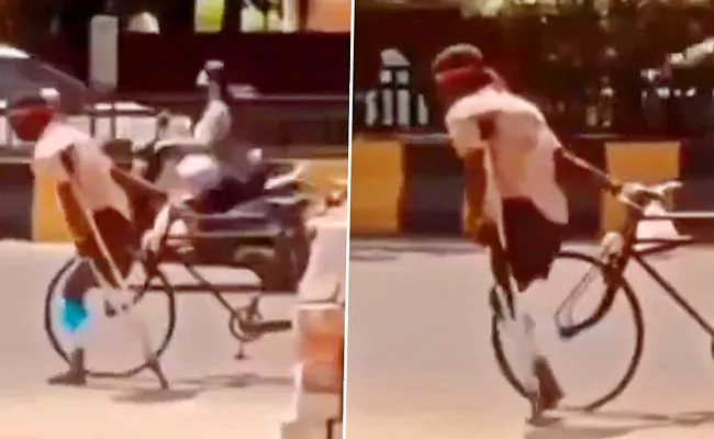 Viral Video: Specially Abled Man Pulling Cart With One Hand  - Sakshi