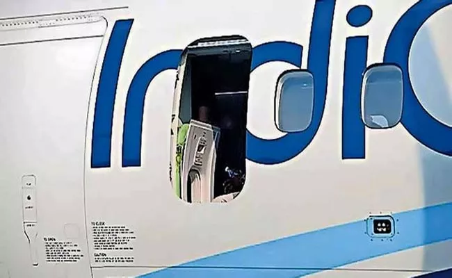 IndiGo passenger Trying To Remove Emergency Exit Over Mid Air - Sakshi