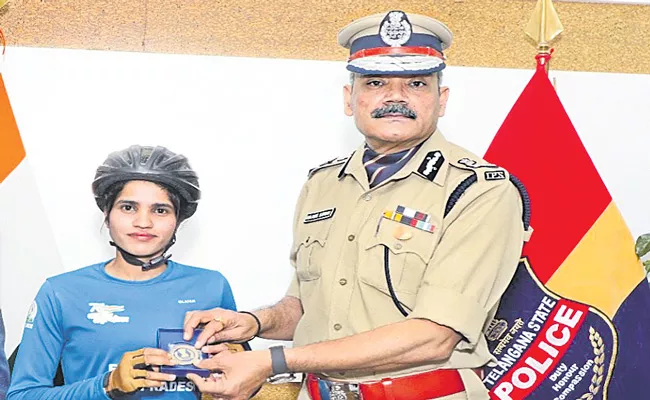 DGP Anjani Kumar congratulated the cyclist - Sakshi