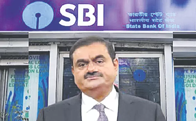 Adani Group firms pledge more shares for SBI - Sakshi