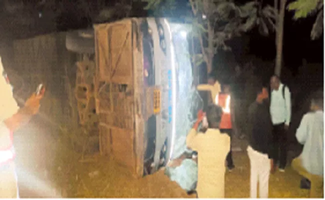 APSRTC Garuda bus overturned at Chillakallu - Sakshi